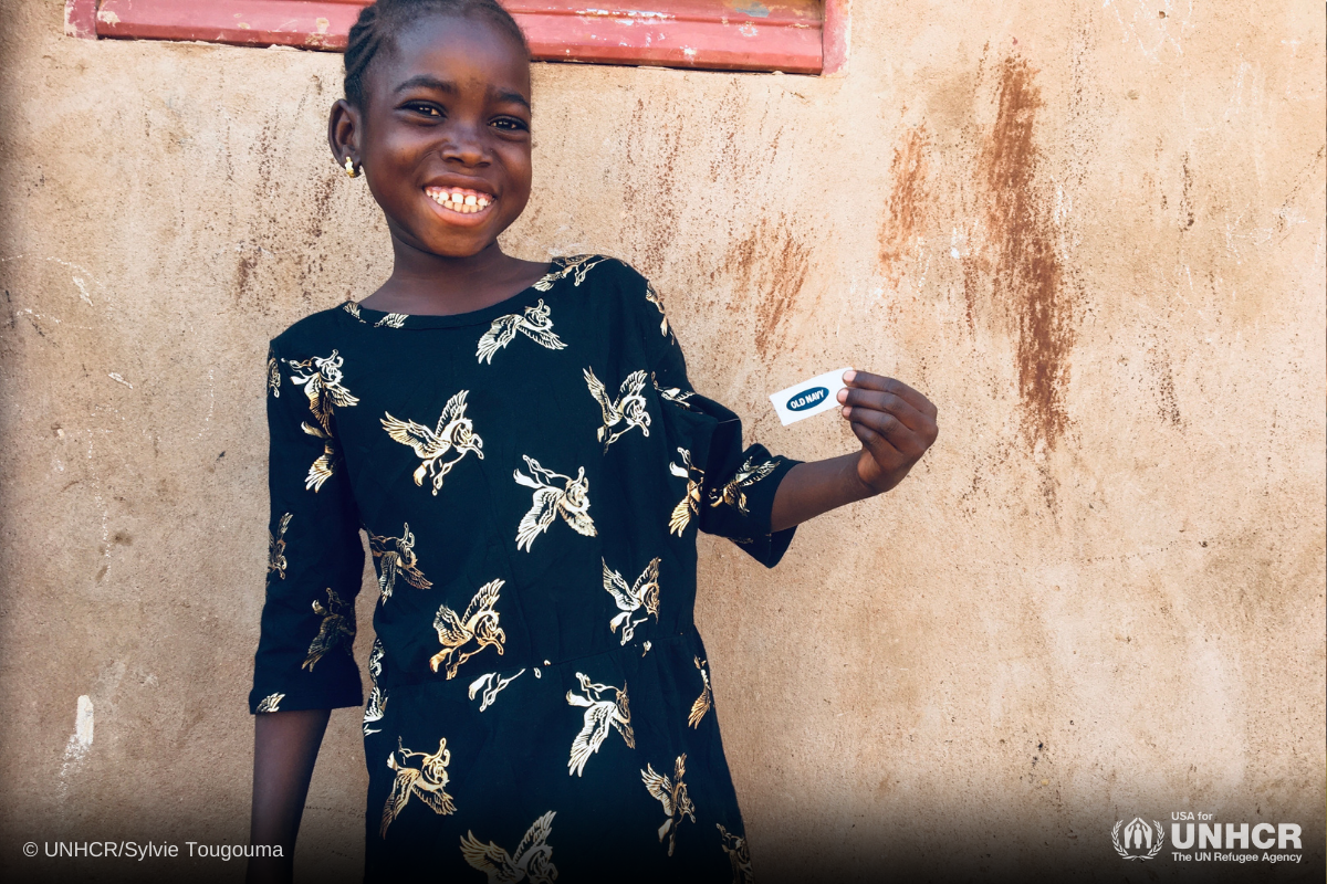 Refugee girl in Burkina Faso wearing a dress from Gap in-kind donation