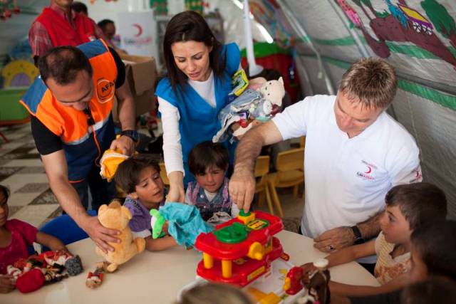 The grown-ups seem to be having as much fun as these delighted Syrian children.