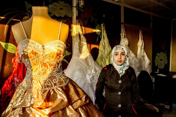 Um Murad’s wedding dress shop and beauty salon in Zaatari, Jordan. Photo by UNHCR/K. Lathigra