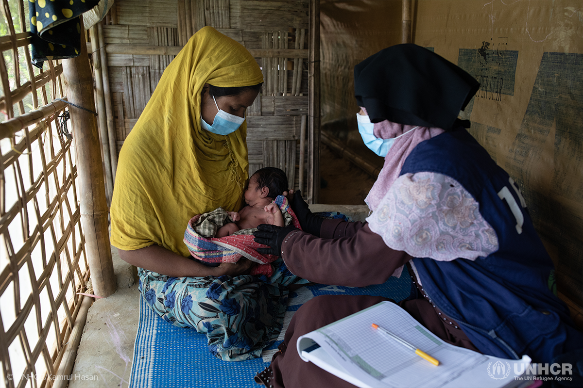 community health volunteer helping new mother