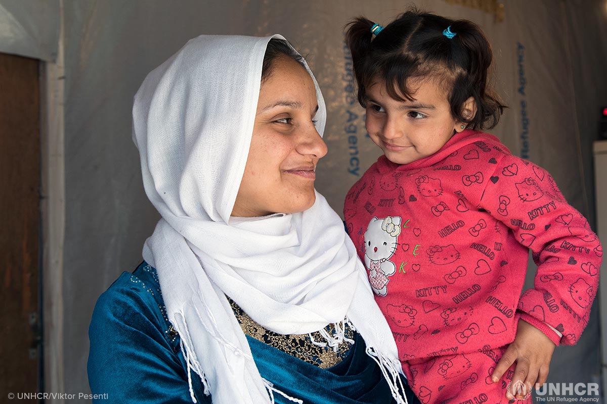 Syrian refugee Amira inside of her home. She is four months pregnant and lives with her husband Hamad, mother-in-law Amina and daughter Amani (3).