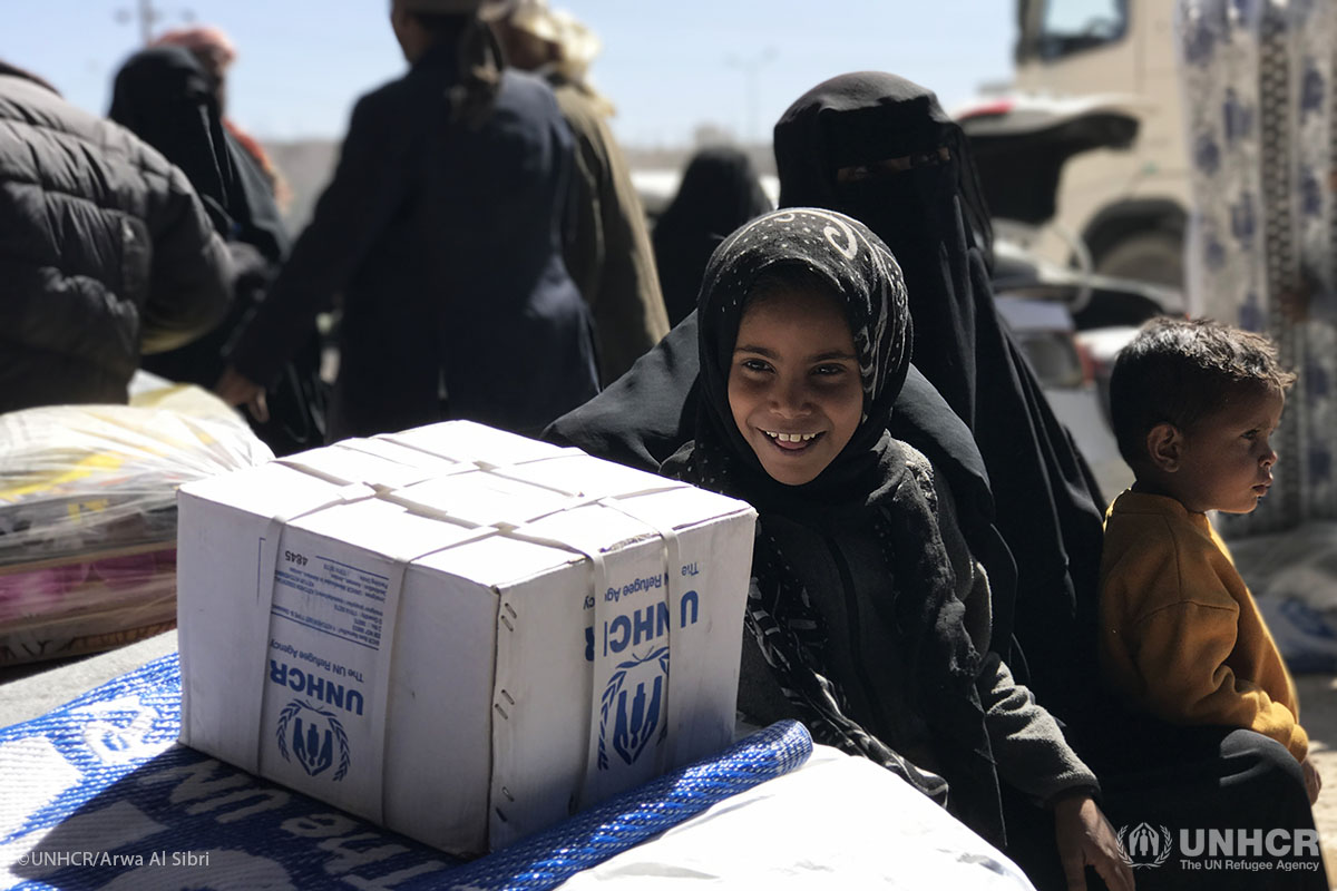 Malak, eight years old, and her brother Muntasir, three years old. sit near UNHCR assistance in Dhamar governorate, Yemen. They fled from Hudaydah and they came with father to receive the assistance.