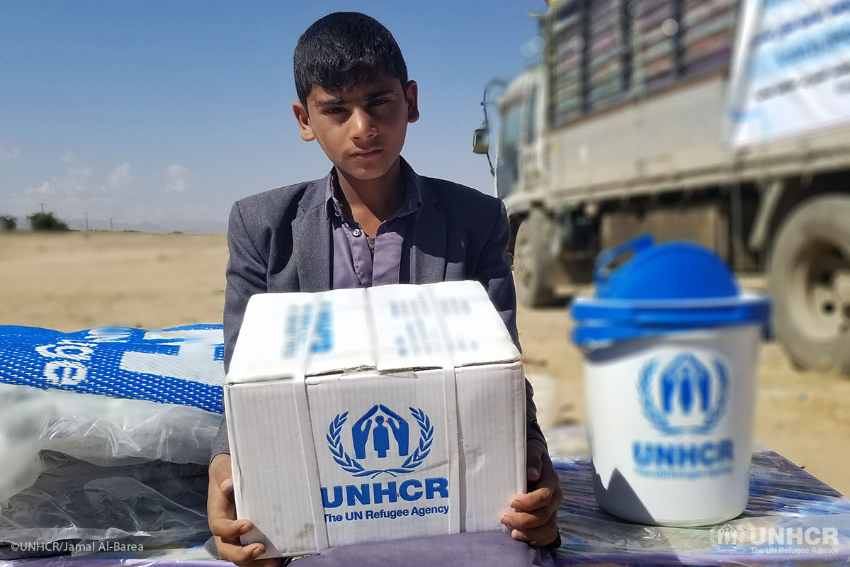 A displaced child from Sa'ada sits near UNHCR assistance. He and his family fled the fighting in Sa'ada's outskirts to Sa'ada city.