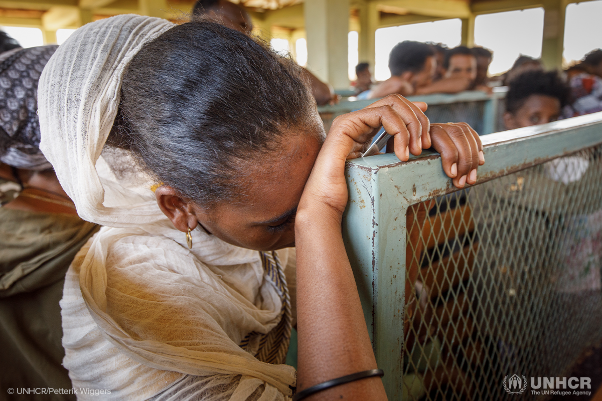 Eritrean refugees wait to receive humanitarian aid at Mai Aini refugee camp in Ethiopia’s Tigray region