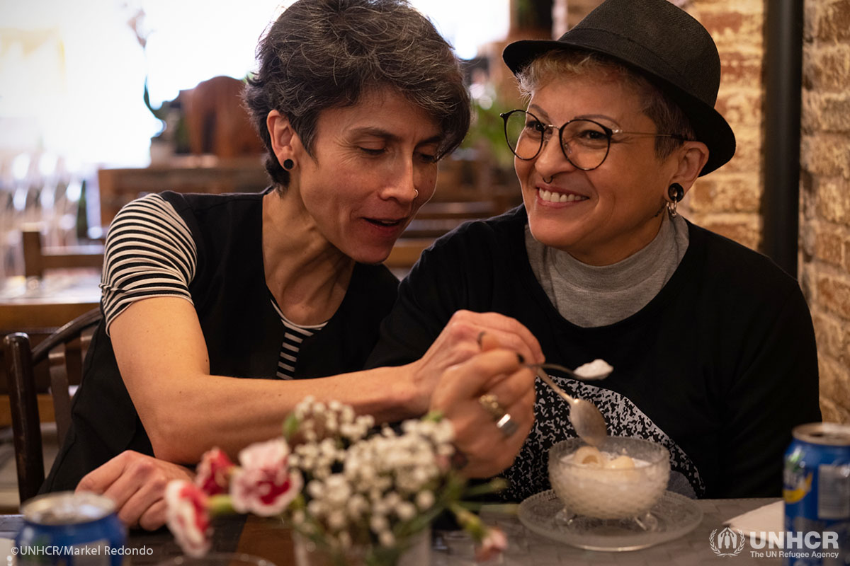 Honduran refugee Maritza, right, with her partner Jenny in Barcelona.  Maritza fled Honduras in 2008 after the rape and murder of a gay friend.