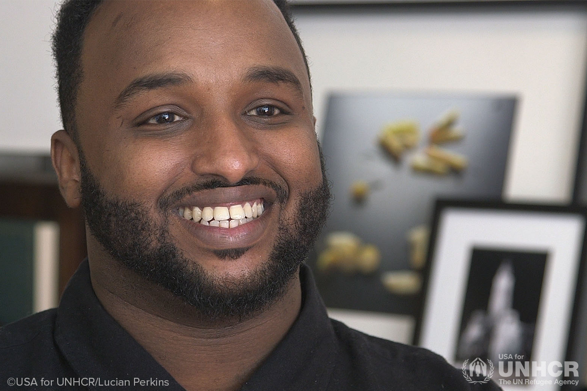 mustafa nuur smiling at camera