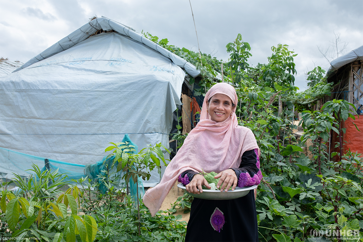 sahera looking at camera and smiling in her garden