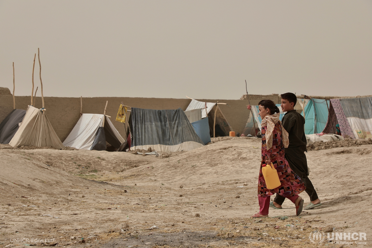 Afghan children gather water