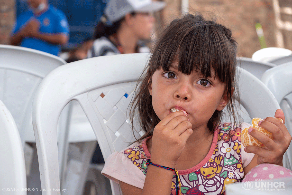 4-year-old Talia loves oranges.