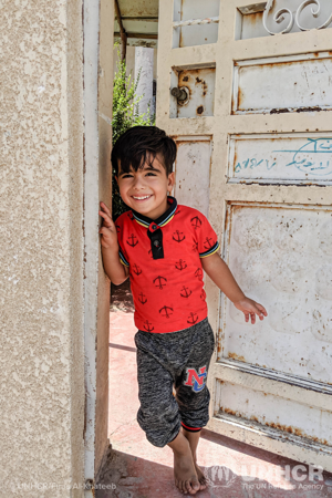 little boy going to school in iraq