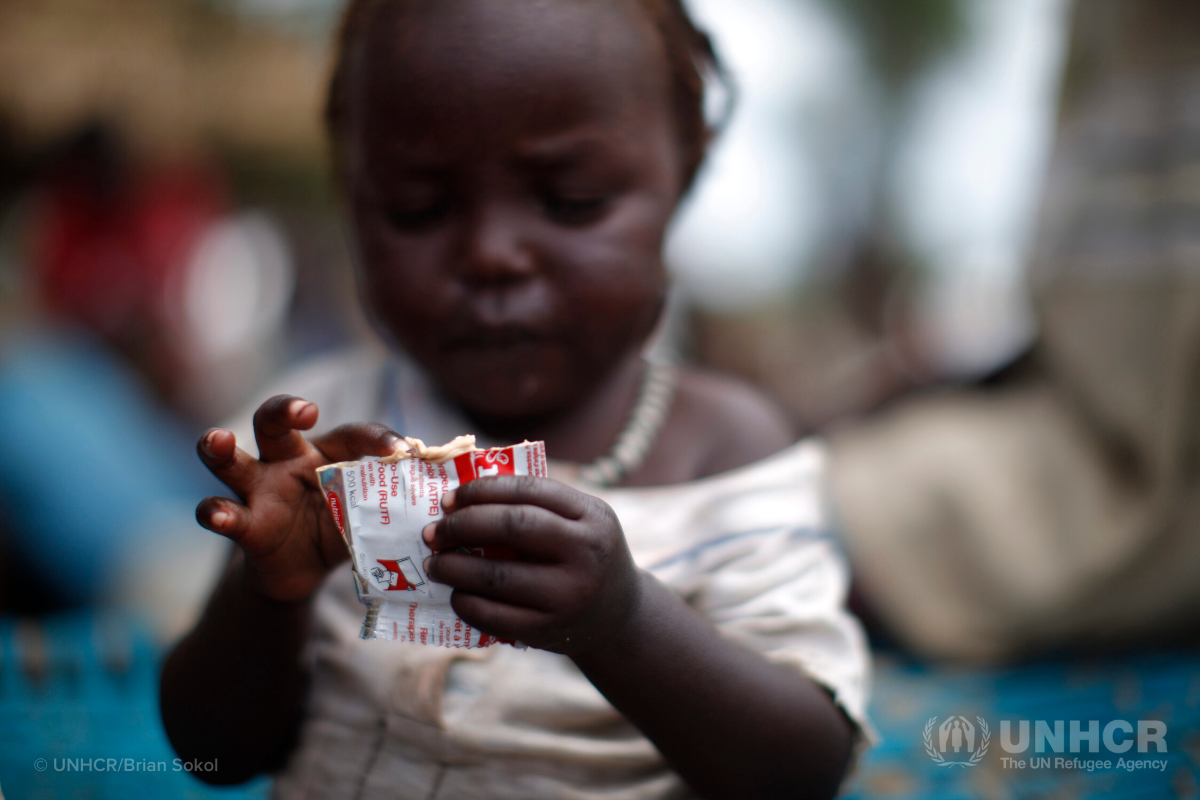 little girl eating therapeutic food