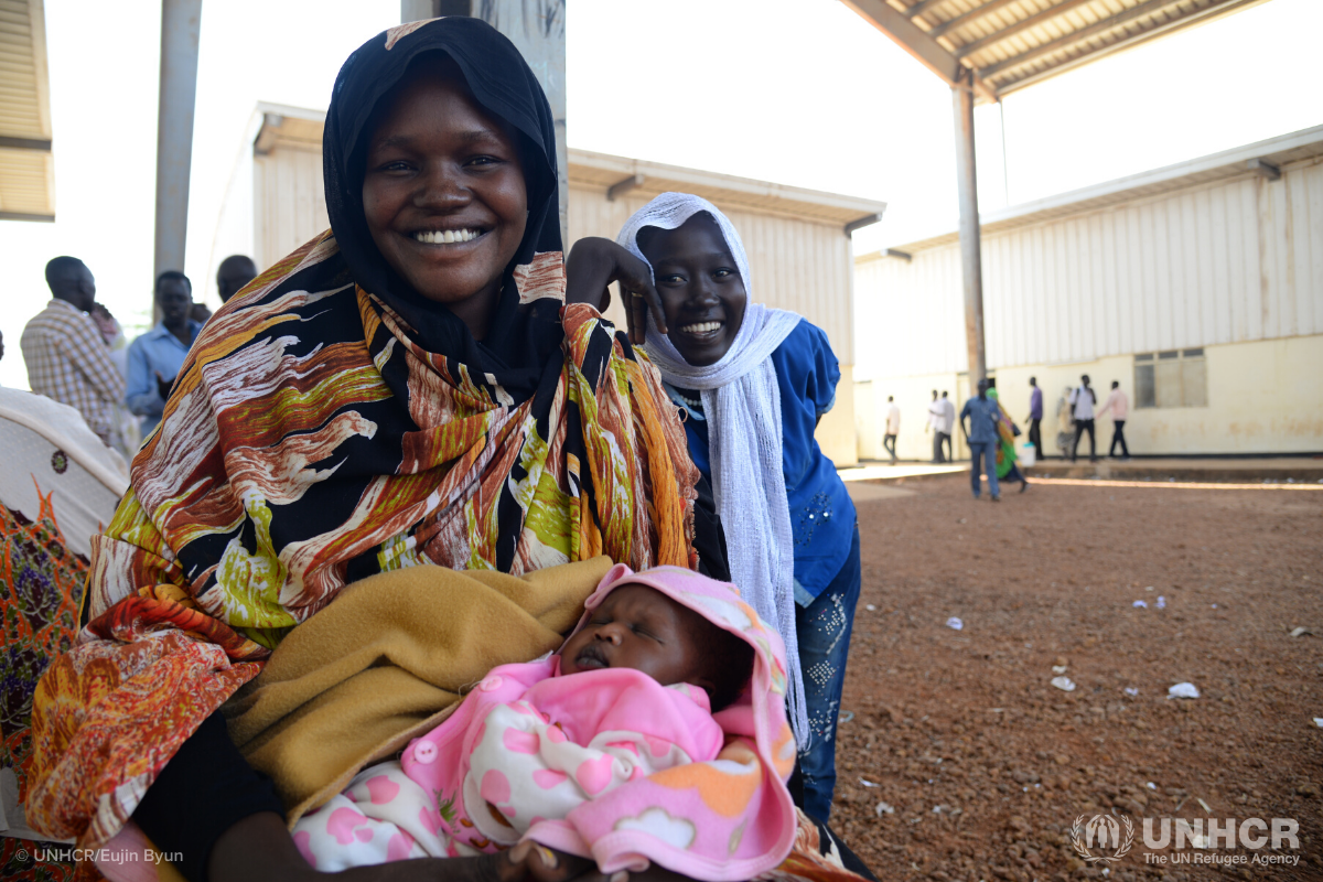 smiling woman with baby