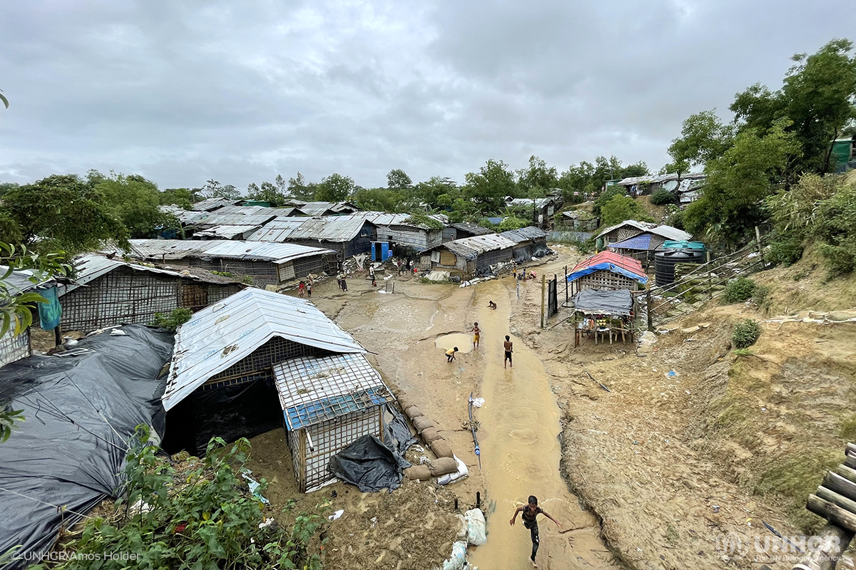 Rohingya refugee children play after a heavy monsoon downpour in Nayapara refugee camp in Teknaf, eastern Bangladesh