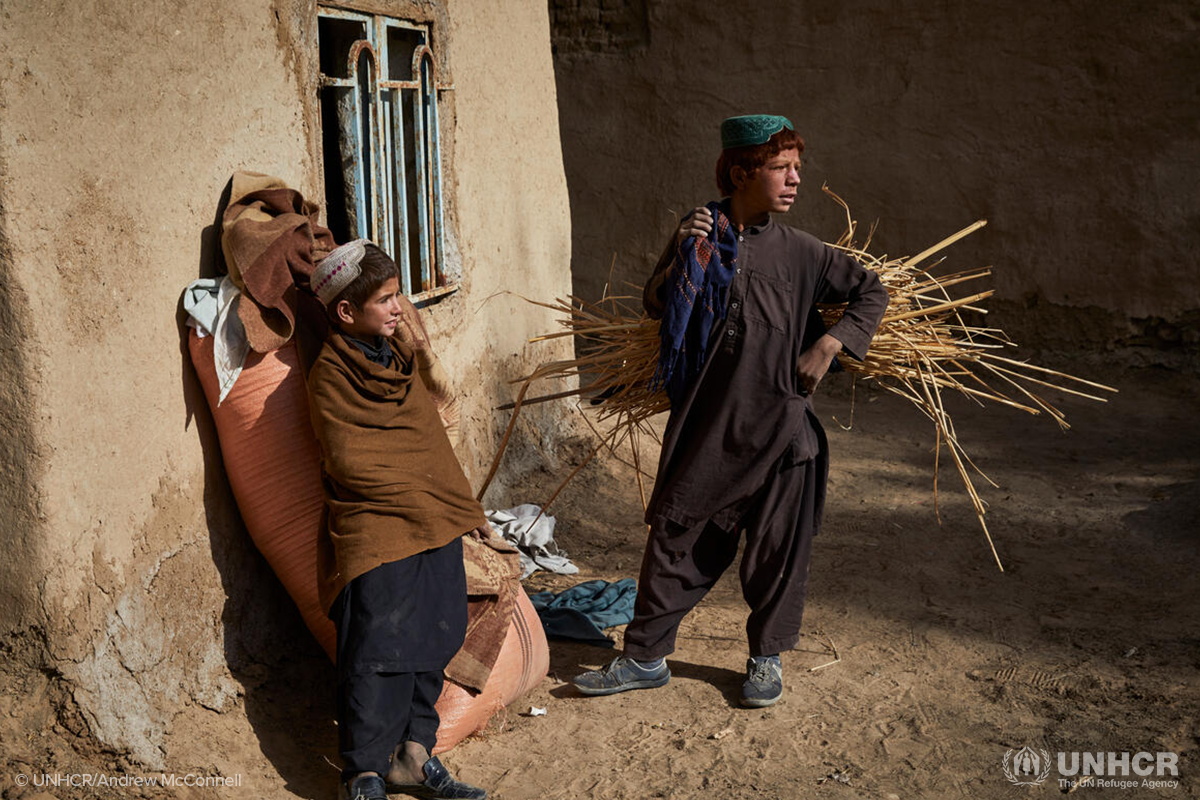 Adbul Wadood stands in his partially damaged home in Marja