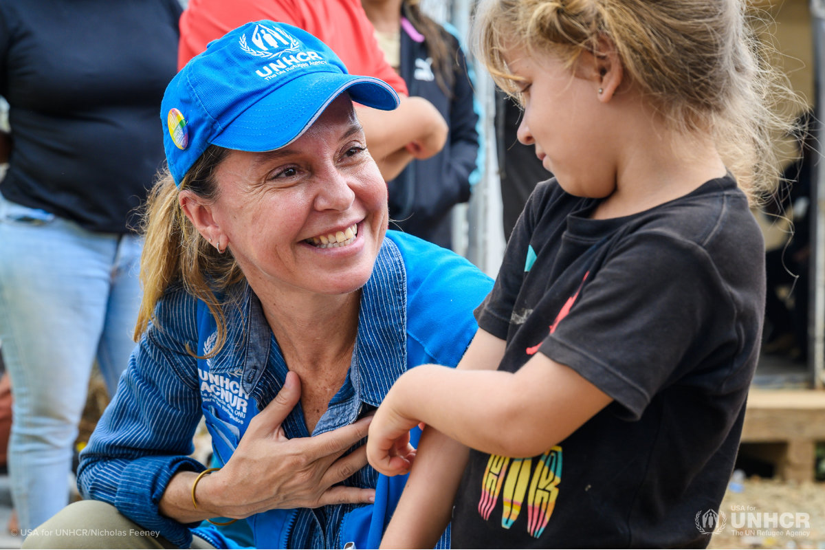 UNHCR staffer and refugee child