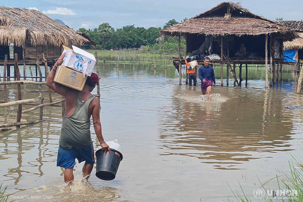 Relief items are delivered to internally displaced people at a flood-prone camp in Myanmar’s Kayin State