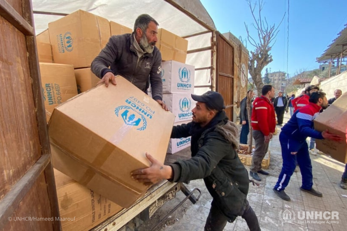 Relief items including high-thermal blankets and kitchen sets are unloaded for distribution at the mosque in the Suleiman Al-Halabi neighbourhood of Aleppo.