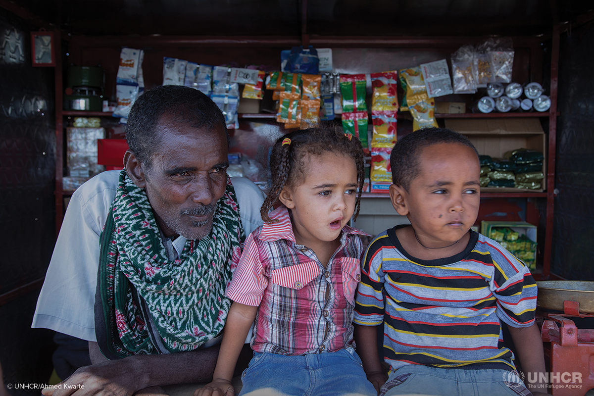 surafuel sitting at his kiosk in a camp for tigrayan refugees