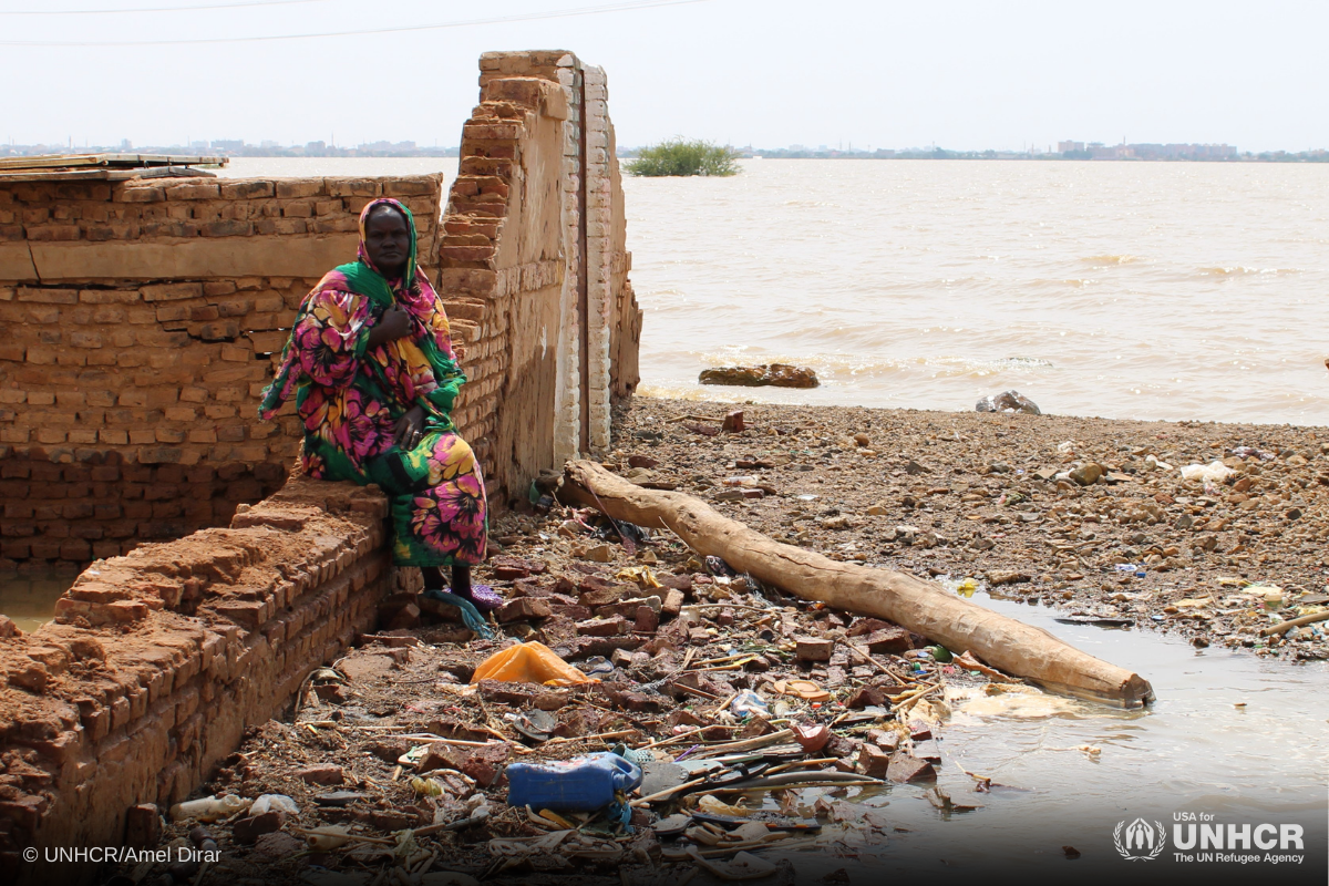 South Sudanese refugee Amira Mario stands on the ruins of her house in Omdurman, Sudan.