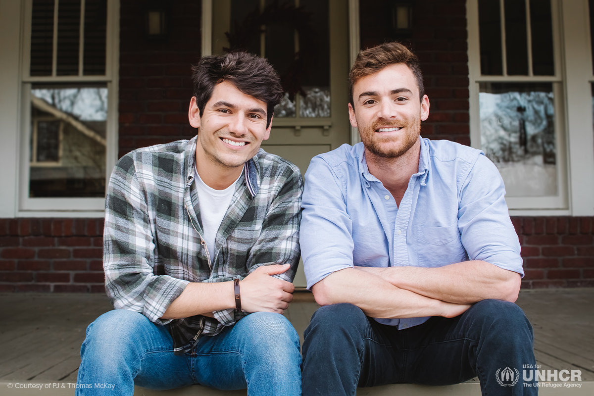 portrait of thomas and pj smiling at the camera