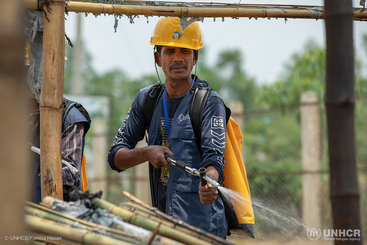 rohingya fire volunteer practicing putting out a fire