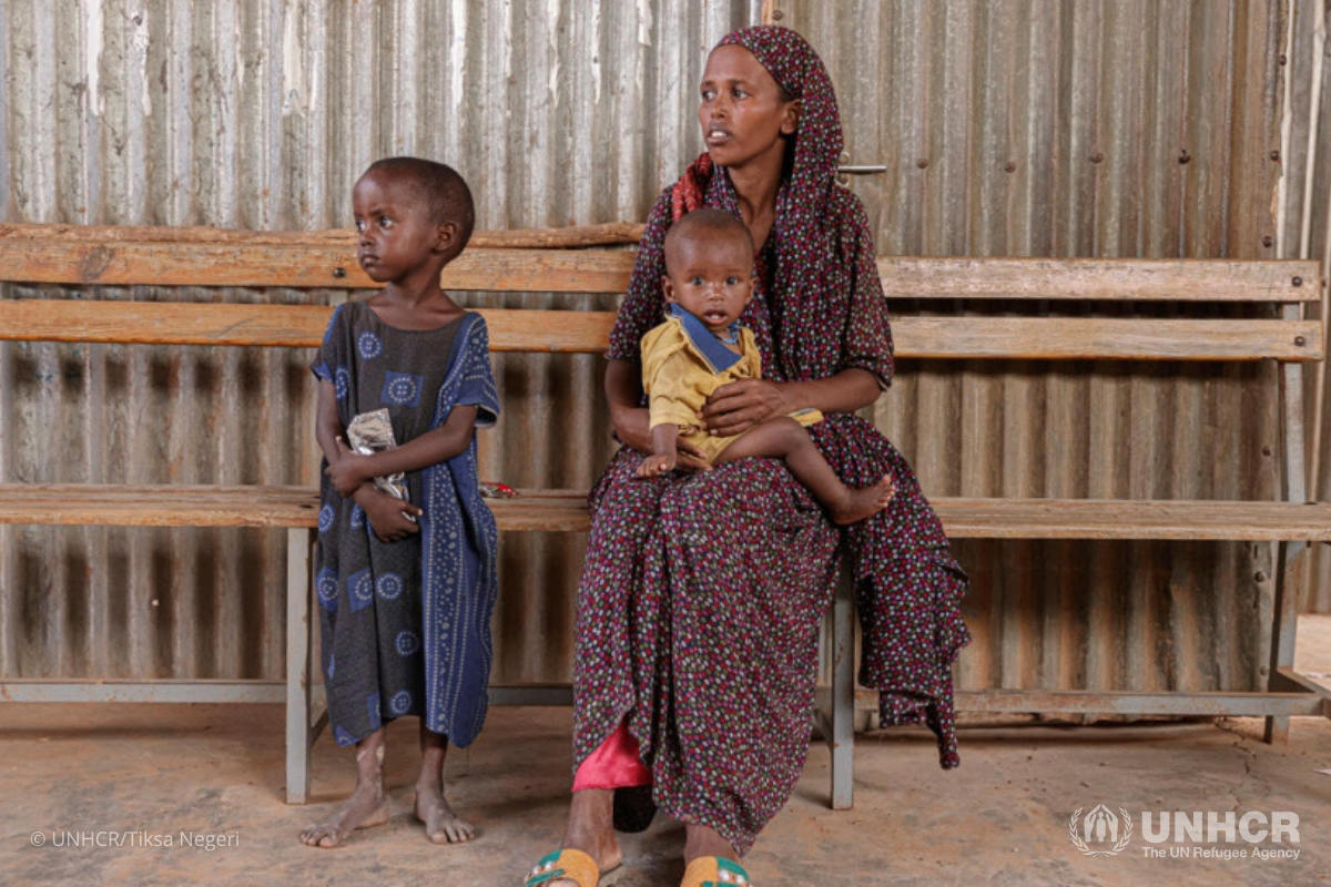 Samira Abdi waits to receive food and treatment for her malnourished children at a nutrition center in the Melkadida refugee camp. 