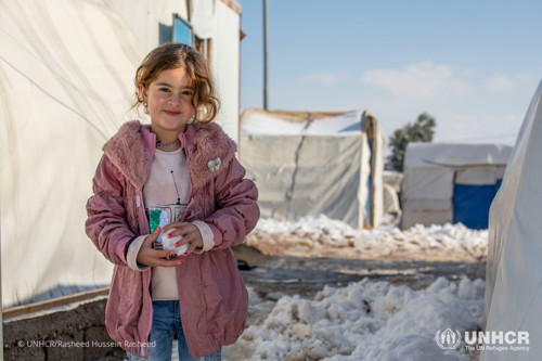 Girls playing with snow outside their shelter at Essian IDP camp near Duhok in Kurdistan Region of Iraq.