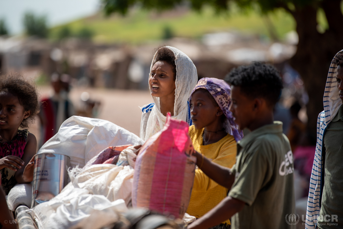 Ethiopian refugees collecting food and supplies