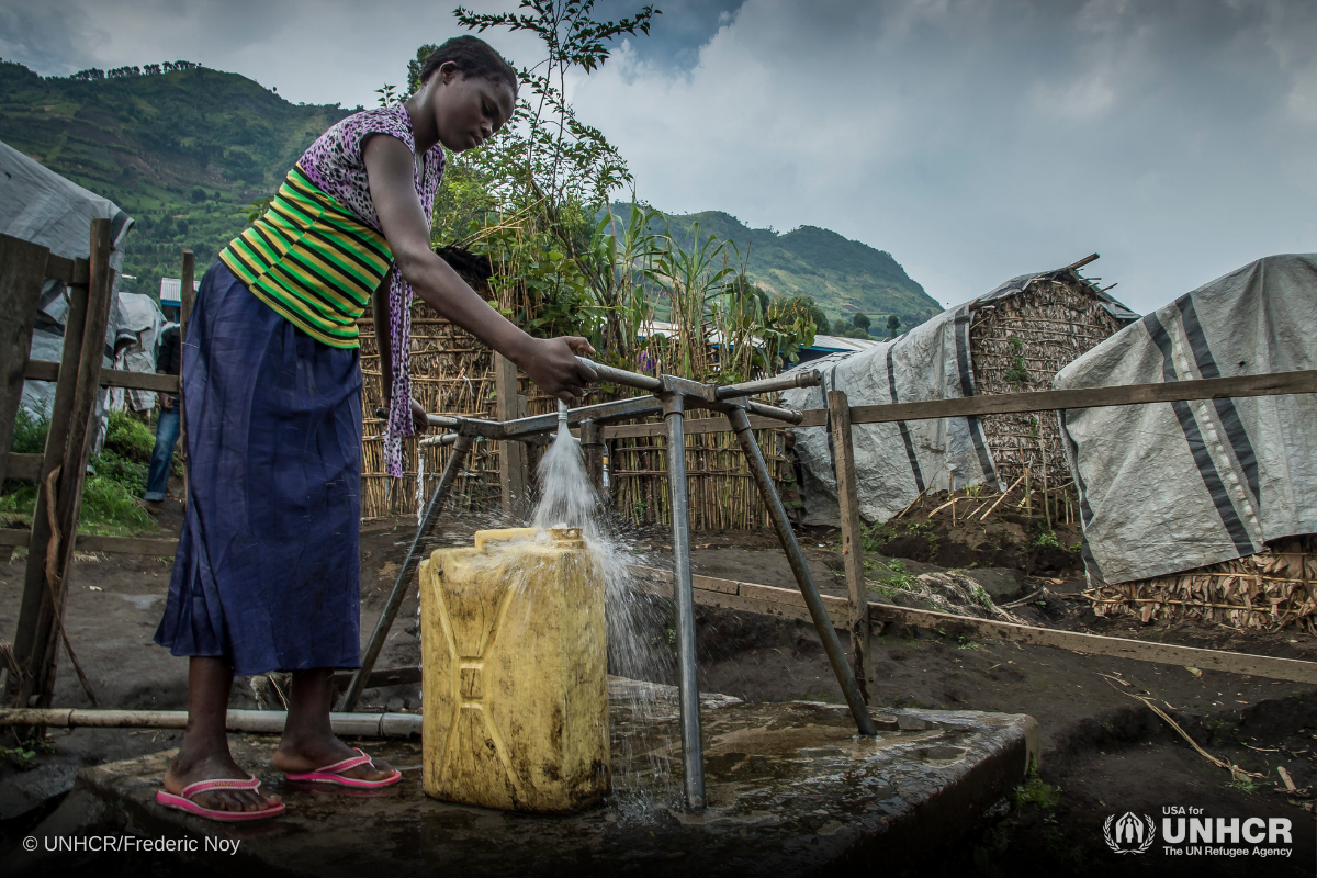 A young girl collects some water at a water point in Kalinga camp in Democratic Republic of the Congo