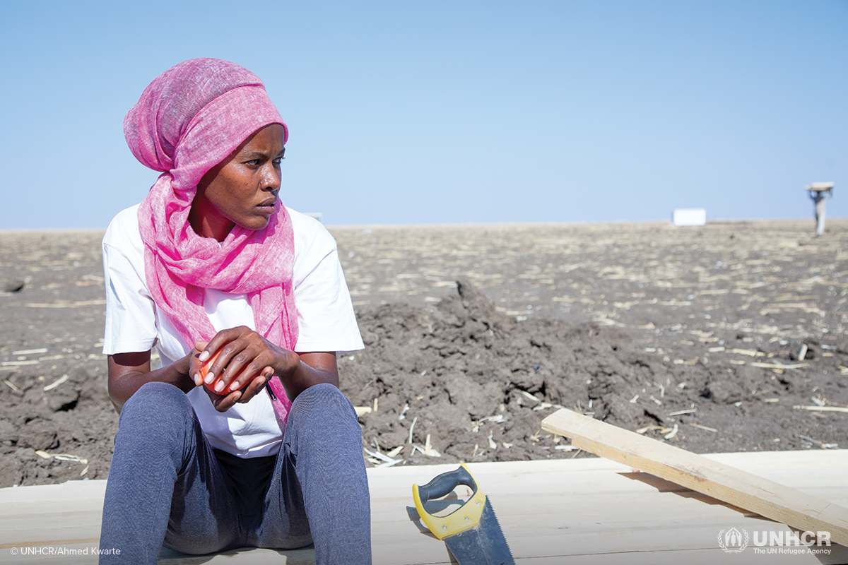 mihret sitting at a construction site