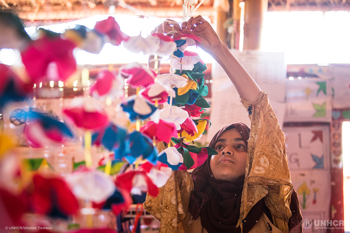 huraima hangs up decorations